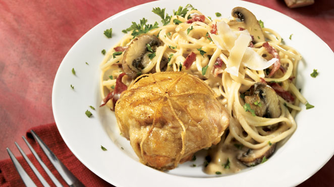 Stuffed chicken thighs on linguine with mushroom cream sauce