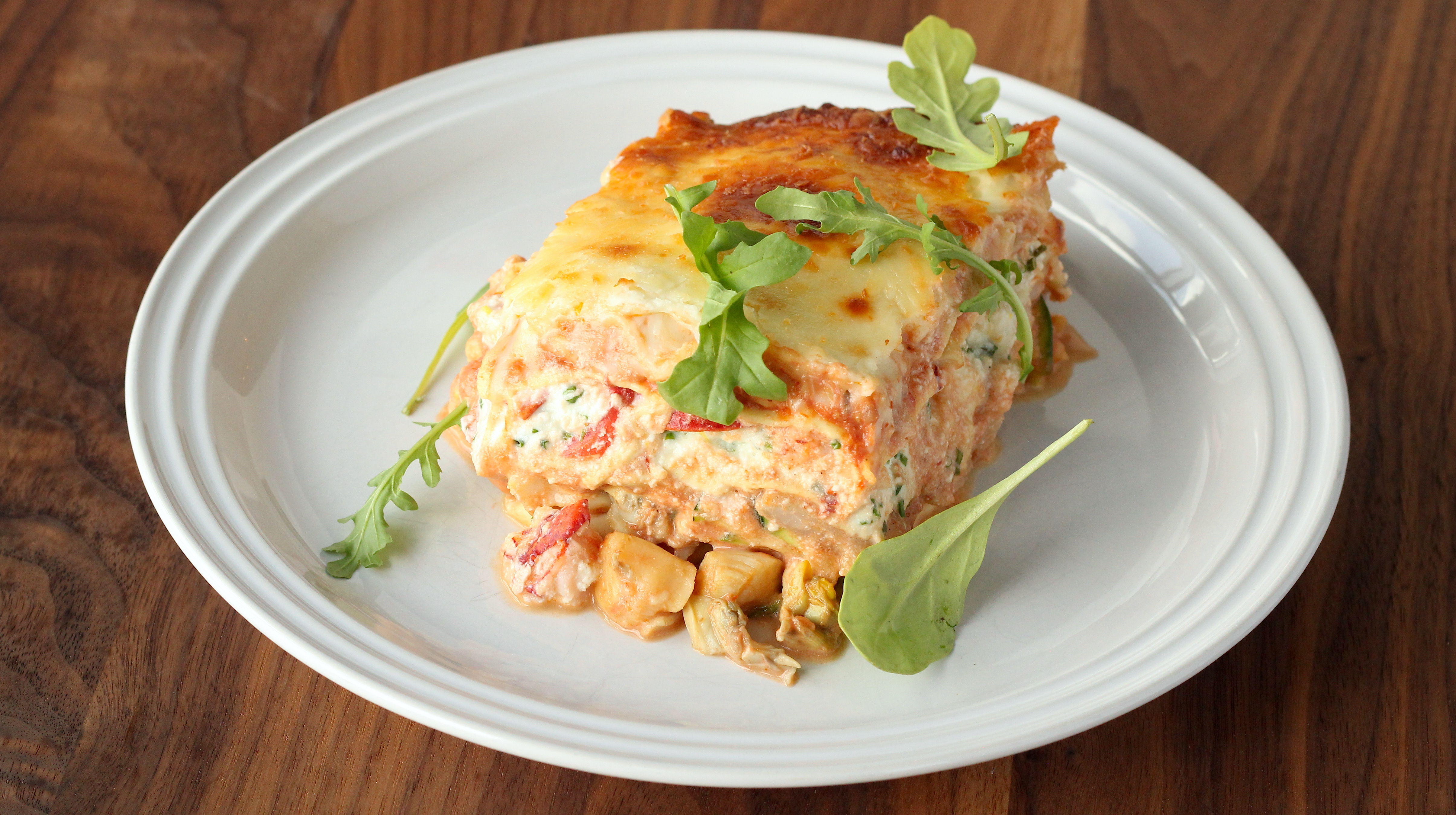 Lasagna with seafood, ricotta, and arugula rosé sauce